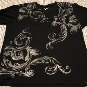 Black T-shirt with silver designs on front.